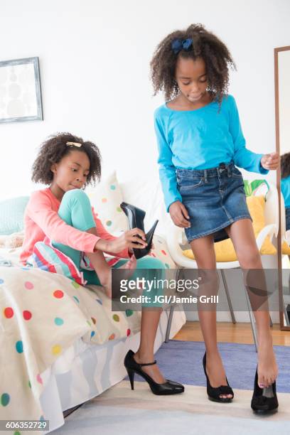 mixed race sisters playing dress up - tween heels stock pictures, royalty-free photos & images