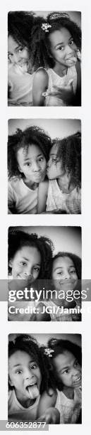 photo strip of mixed race sisters - fotobooth stock-fotos und bilder