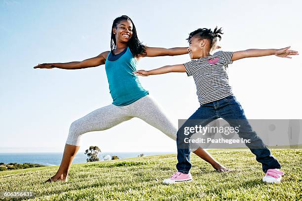 black mother and daughter practicing yoga - 39 year old stock pictures, royalty-free photos & images