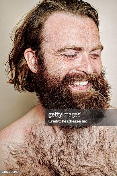 caucasian man smiling - brusthaar stock-fotos und bilder