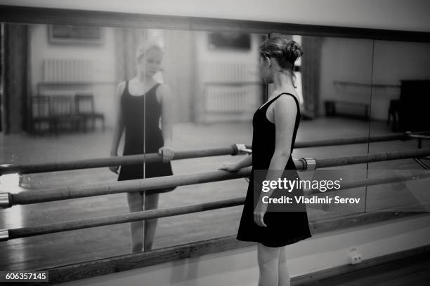 caucasian ballerina standing at barre - ballet dancers russia stock pictures, royalty-free photos & images