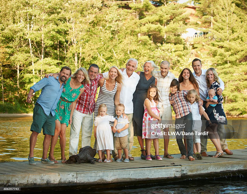 Caucasian family smiling on pier