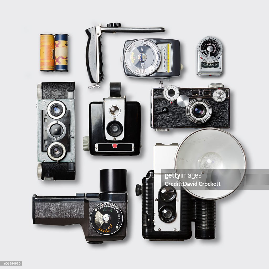 Vintage Cameras And Photography Equipment On White Tabletop High