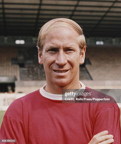 English footballer and midfielder with Manchester United Football Club, Bobby Charlton posed on the pitch at United's Old Trafford stadium in...