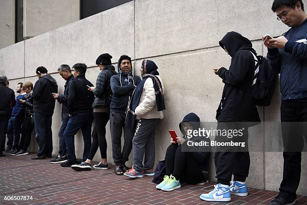 Customers wait in line for the release of the Apple Inc. IPhone 7 and 7 Plus an Apple Inc. In San Francisco, California, U.S., on Friday, Sept. 16,...