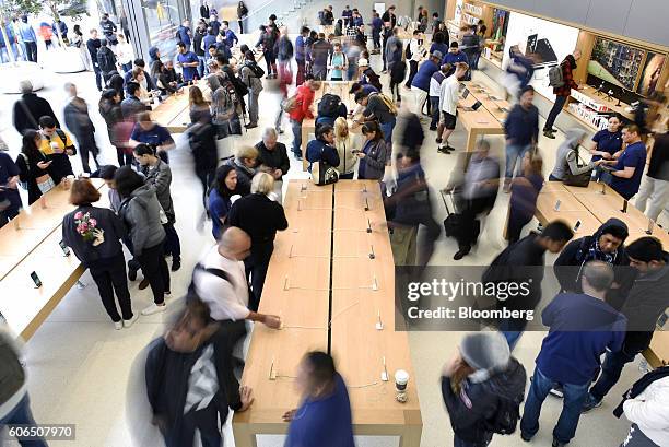 Customers browse products during the release of the Apple Inc. IPhone 7 and 7 Plus smartphones at an Apple Inc. In San Francisco, California, U.S.,...