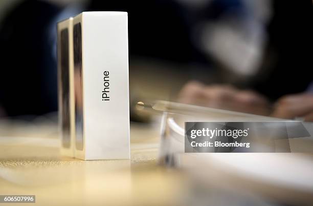 Boxes of iPhone 7 smartphones sit on a table at an Apple Inc. In San Francisco, California, U.S., on Friday, Sept. 16, 2016. Shoppers looking to buy...