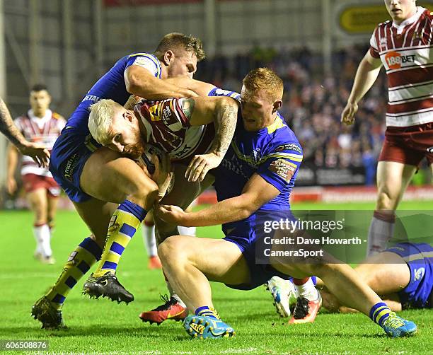 Wigan Warriors' Sam Tomkins goes over for his sides 2nd try during the First Utility Super League Super 8s Round 6 match between Warrington Wolves...