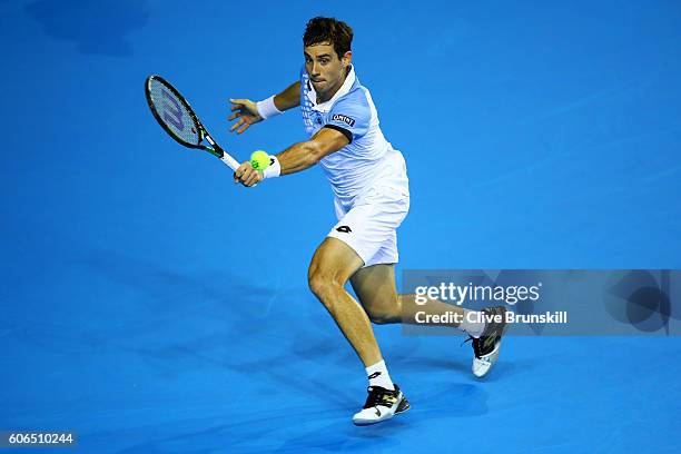 Guido Pella of Argentina hits a backhand during his singles match against Kyle Edmund of Great Britain during day one of the Davis Cup Semi Final...