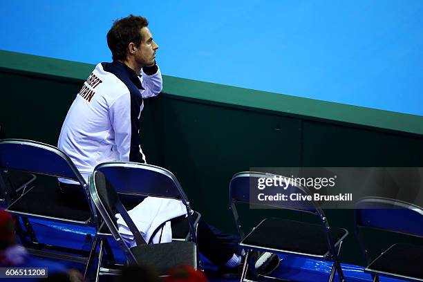 Andy Murray of Great Britain watches team-mate Kyle Edmund of Great Britain during his singles match against Guido Pella of Argentina during day one...