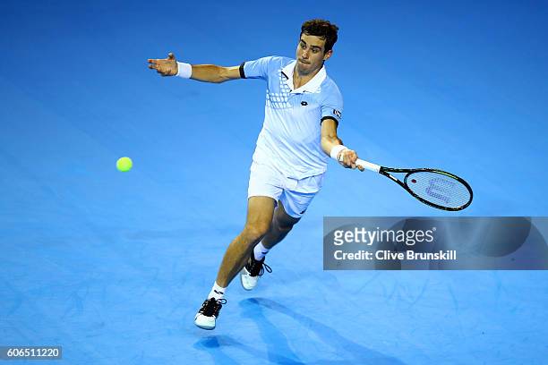 Guido Pella of Argentina hits a forehand during his singles match against Kyle Edmund of Great Britain during day one of the Davis Cup Semi Final...