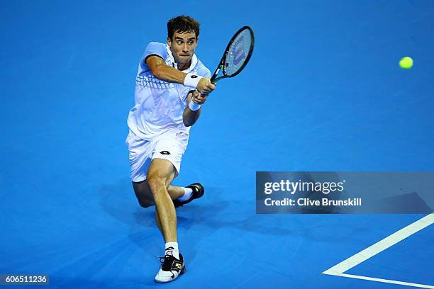 Guido Pella of Argentina hits a backhand during his singles match against Kyle Edmund of Great Britain during day one of the Davis Cup Semi Final...