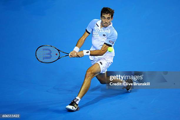 Guido Pella of Argentina hits a backhand during his singles match against Kyle Edmund of Great Britain during day one of the Davis Cup Semi Final...