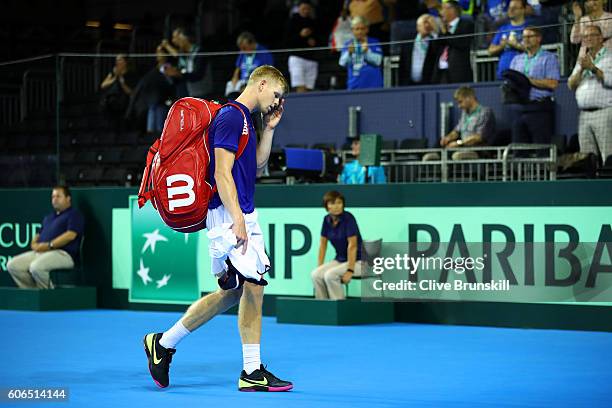 Kyle Edmund of Great Britain leaves the court following his defeat in the singles match against Guido Pella of Argentina during day one of the Davis...