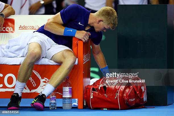 Kyle Edmund of Great Britain prepares to leave the court following his defeat in the singles match against Guido Pella of Argentina during day one of...
