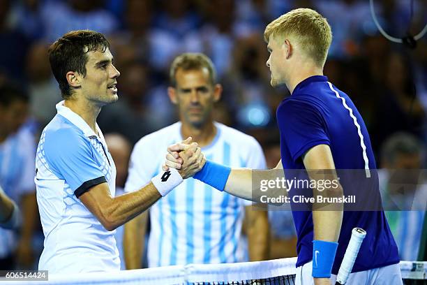 Guido Pella of Argentina shakes hands with Kyle Edmund of Great Britain after their singles match during day one of the Davis Cup Semi Final between...