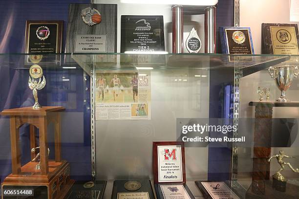 Newspaper clipping on hi NCAA title run adorns the athletics trophy case. Olympic triple sprint medalist, Andre De Grasse returns his alma mater,...