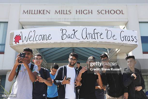 Students wait for Andre De Grasse outside. Olympic triple sprint medalist, Andre De Grasse returns his alma mater, Milliken Mills High School, to...