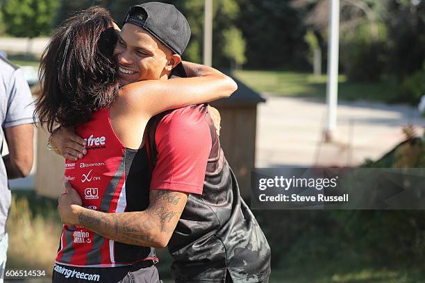 Andre De Grasse gives one last hug to his high school track coach Liana Williams. Olympic triple sprint medalist, Andre De Grasse returns his alma...