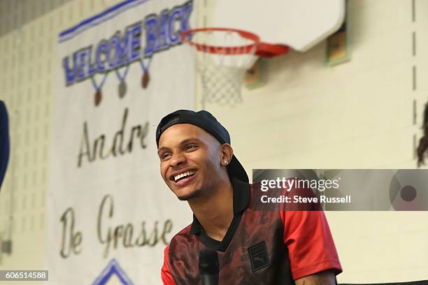 Andre De Grasse laughs as a student challenges him to a sprint. Olympic triple sprint medalist, Andre De Grasse returns his alma mater, Milliken...