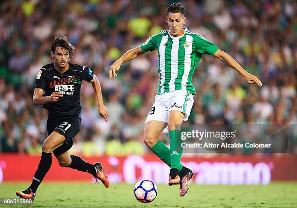 Alex Alegria of Real Betis Balompie being followed by Rene Krhin of Granada CF during the match between Real Betis Balompie vs Granada CF as part of...