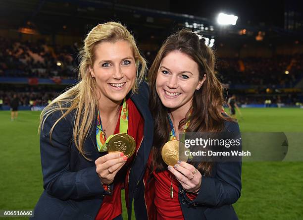 Team GB Olympic hockey gold medalists Georgie Twigg and Laura Unsworth pose at half time during the Premier League match between Chelsea and...