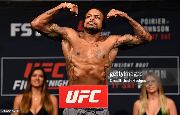 Michael Johnson of the United States steps onto the scale during the UFC Fight Night weigh-in at the State Farm Arena on September 16, 2016 in...