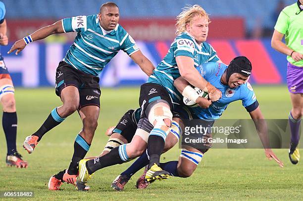 Marvin Orie of the Vodacom Blue Bulls tackled by Sias Koen of the Griquas during the Currie Cup match between Vodacom Blue Bulls and Griquas at...