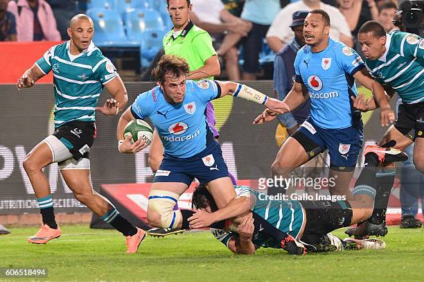Jonathan Francke of the Griquas tackles Burger Odendaal of the Vodacom Blue Bulls during the Currie Cup match between Vodacom Blue Bulls and Griquas...