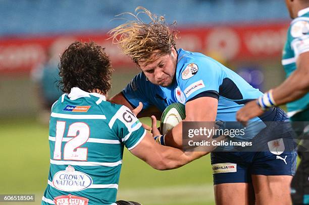 Clinton Swart of the Griquas tackles Pierre Schoeman of the Vodacom Blue Bulls during the Currie Cup match between Vodacom Blue Bulls and Griquas at...