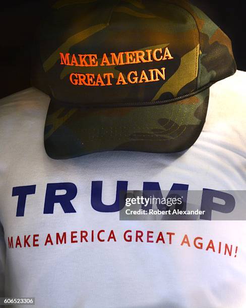 August 27, 2016: T-shirts and hats printed and embroidered with Donald Trump's presidental campaign slogan, 'Make American Great Again,' for sale in...