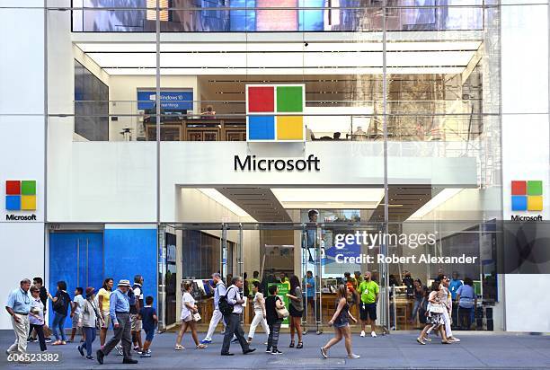 August 27, 2016: New York City shoppers and visitors walk past the Microsoft store on Fifth Avenue on August 27, 2016.