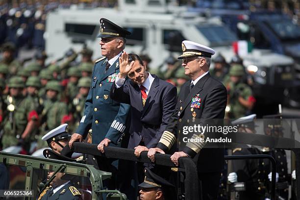 President of Mexico Enrique Pena Nieto flanked by Defense Secretary Salvador Cienfuegos Zepeda and Admiral Vidal Francisco Soberon Sanz review the...