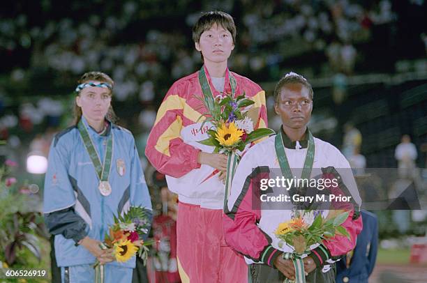 The medalists on the podium after the Women's 5000 metres event at the Centennial Olympic Stadium, at the Olympic Games in Atlanta, Georgia, 28th...