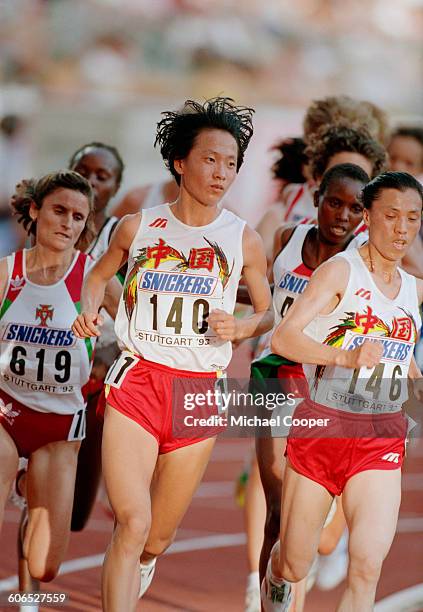 Chinese long-distance runners Wang Junxia and Zhong Huandi competing in the Women's 10,000 Metres event at the 4th International Association of...