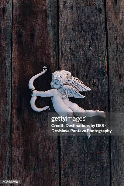 symbols of love - bow and arrow stock pictures, royalty-free photos & images