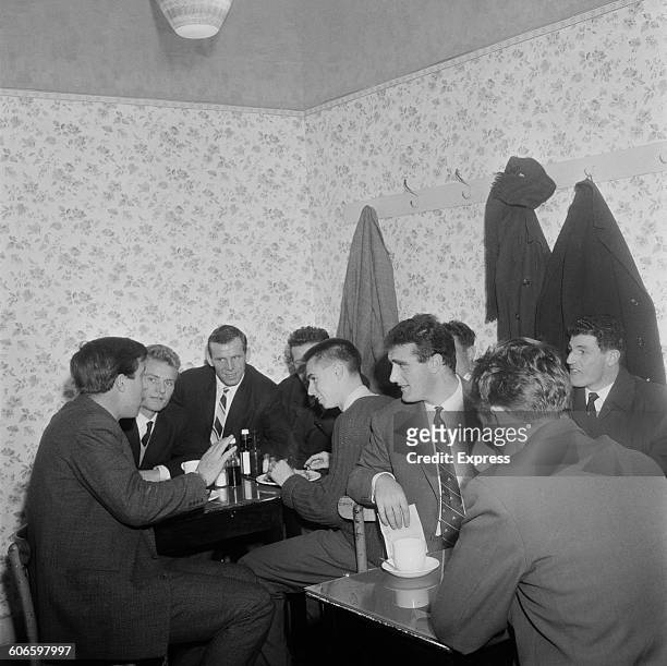 West Ham United footballers discuss the upcoming Professional Footballers' Association strike in a cafe in London's East End, 11th November 1960. The...