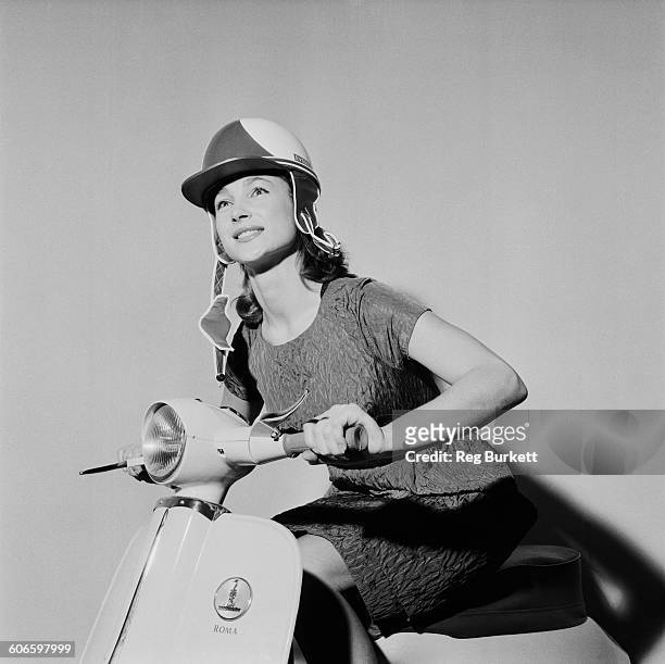 English actress and model Shirley Anne Field poses on a new Raleigh Roma scooter, UK, 11th November 1960.