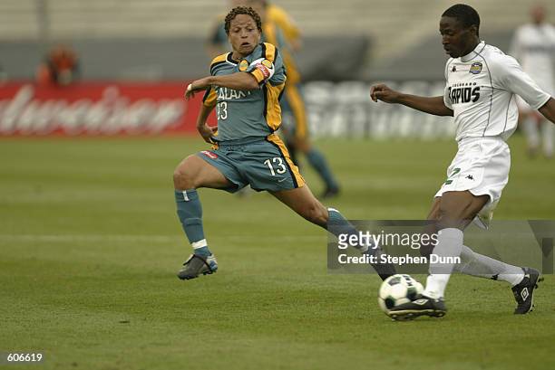 Cobi Jones of the Los Angeles Galaxy tries to block a pass by Robin Fraser of the Colorado Rapids in their MLS game at the Rose Bowl in Pasadena,...
