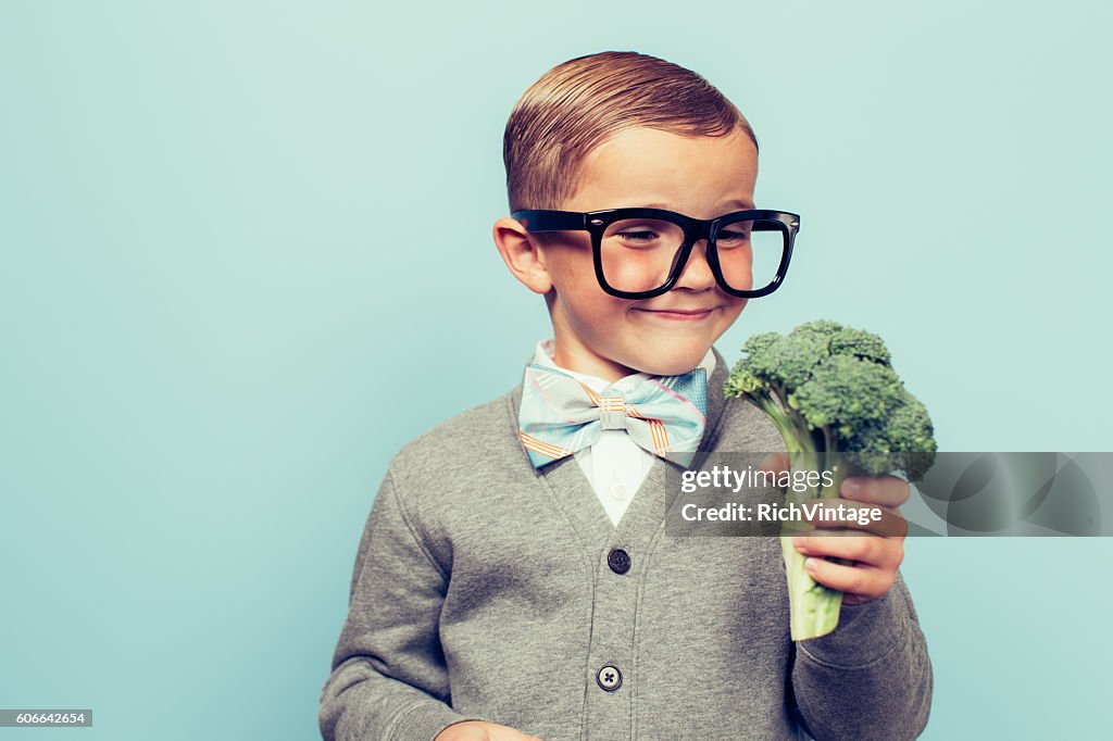 Young Nerd Boy Loves Eating Vegetables