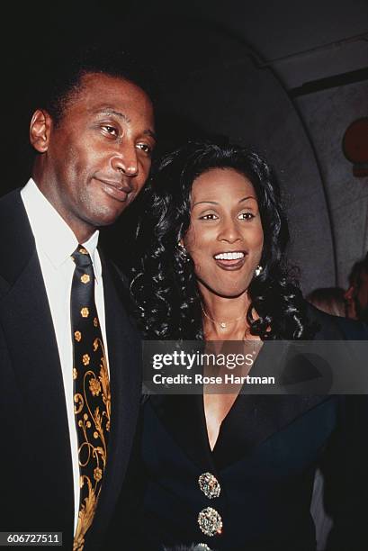 Model Beverly Johnson and radio DJ Frankie Crocker at the 69th Regiment Armory in New York City for the Second Annual Sports Ball, 18th April 1996.