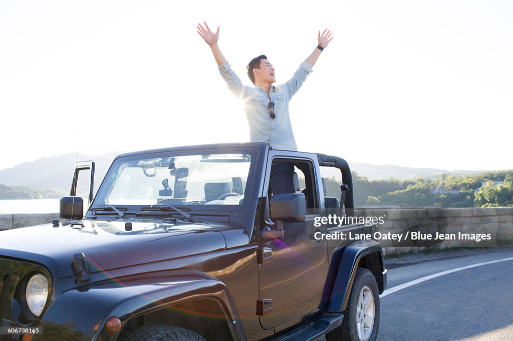 Young man and jeep