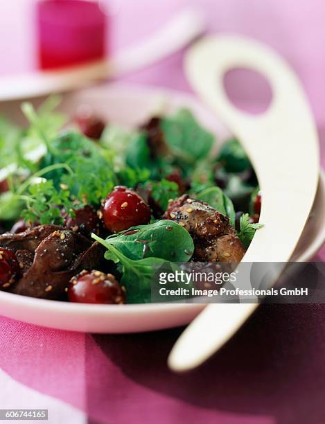 mesclun, poultry liver and cherry salad - feldsalat stock-fotos und bilder
