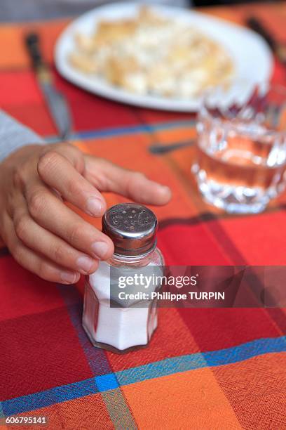 Hand Using Salt Shaker Hand Holding Salt Shaker Photos and Premium High Res Pictures - Getty ...