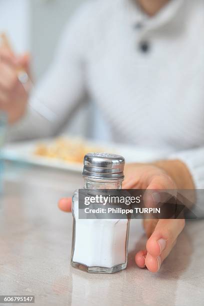 Hand Using Salt Shaker Hand Holding Salt Shaker Photos and Premium High Res Pictures - Getty ...