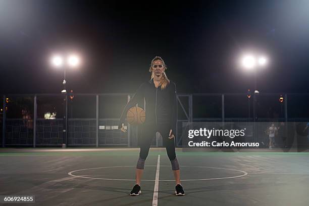 young woman exercising - womens basketball stock-fotos und bilder