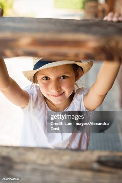 portrait of little girl with sun hat - alexandra dost stockfoto's en -beelden