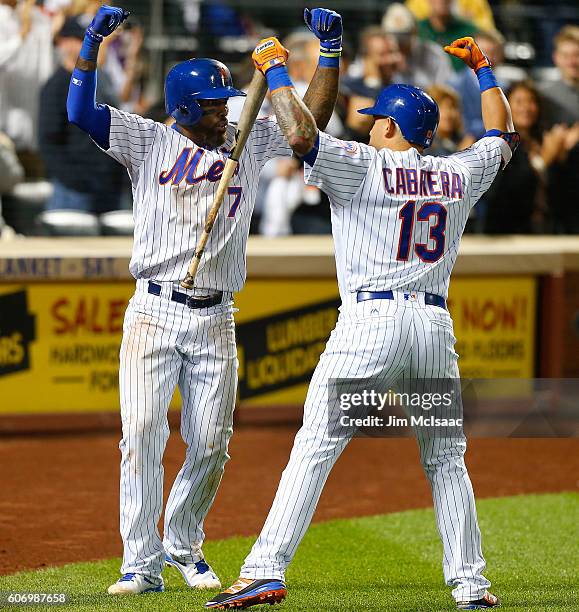 Jose Reyes of the New York Mets celebrates his third inning home run against the Minnesota Twins with teammate Asdrubal Cabrera at Citi Field on...