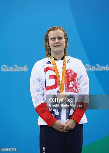 Bronze medalist Hannah Russell of Great Britain celebrates on the podium at the medal ceremony for the Women's 100m Freestyle - S13 on day 9 of the...