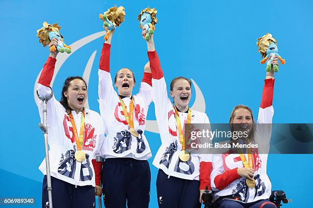 Gold medalists Alice Tai, Claire Cashmore, Stephanie Slater and Stephanie Millward of Great Britain celebrate on the podium at the medal ceremony for...
